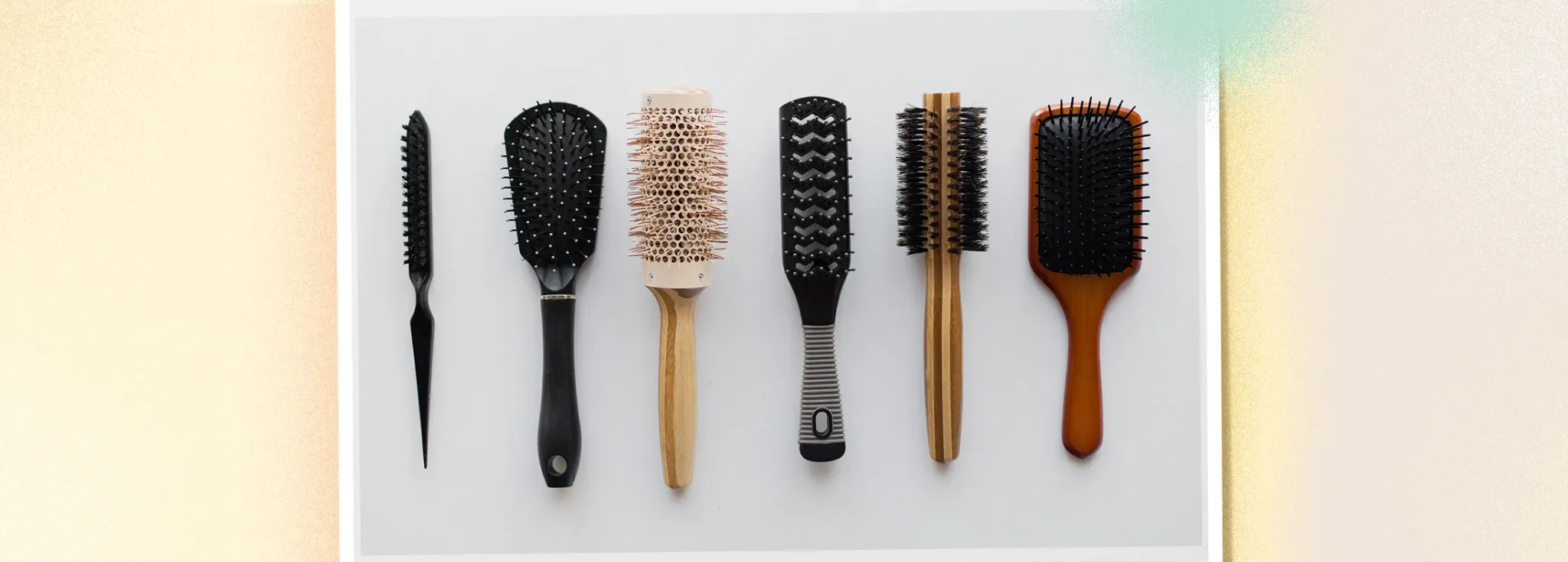 Common types of hair brushes including paddle brush, round brush, and boar bristle brush