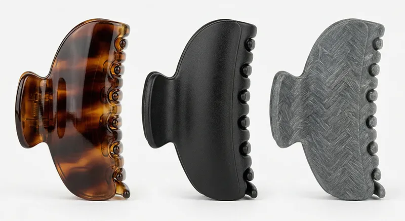 Side by side comparison of acetate, ABS plastic and nylon claw clips showing material differences