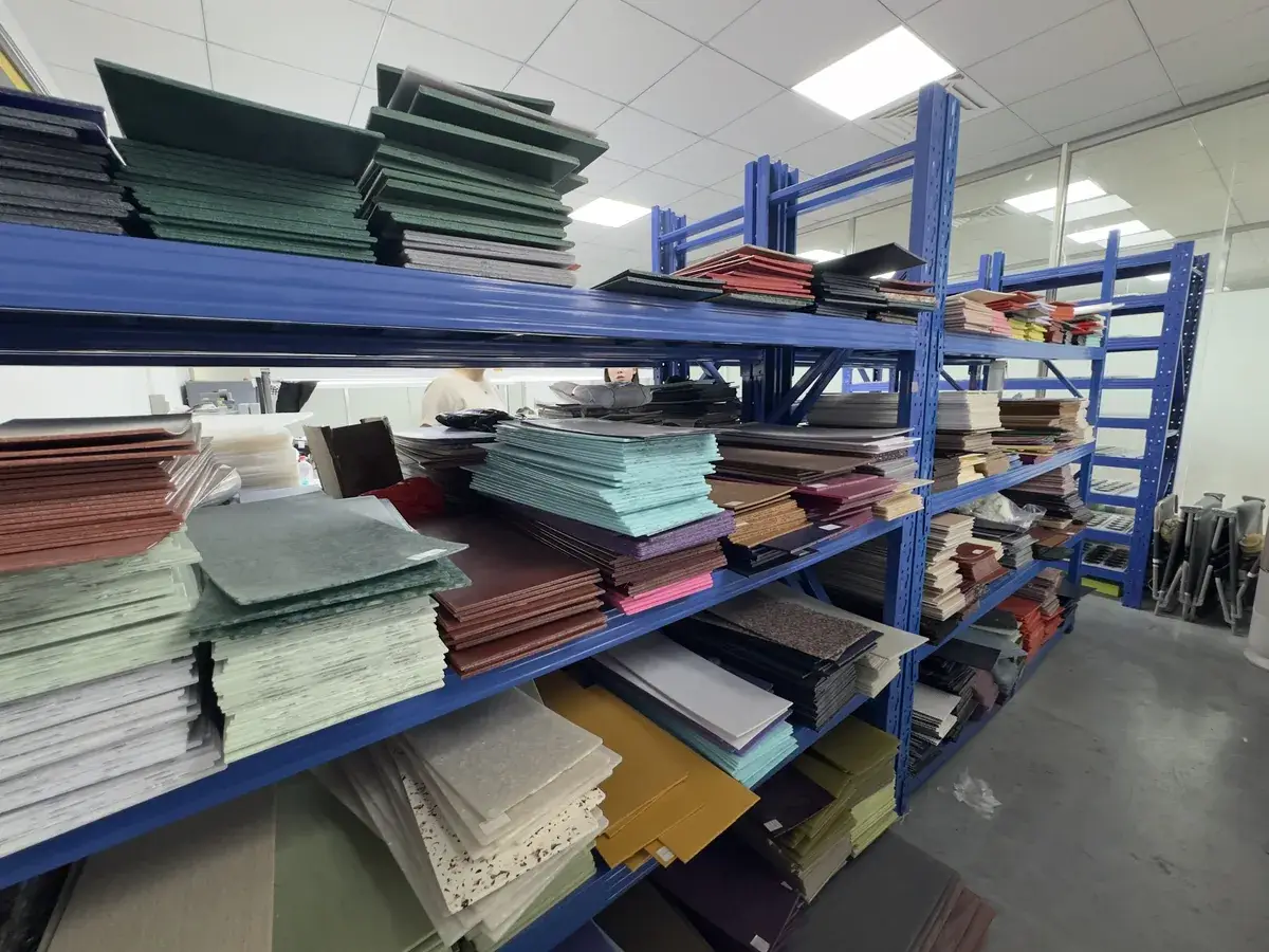 Racks of cellulose acetate sheets in many colours and patterns in the sheet warehouse